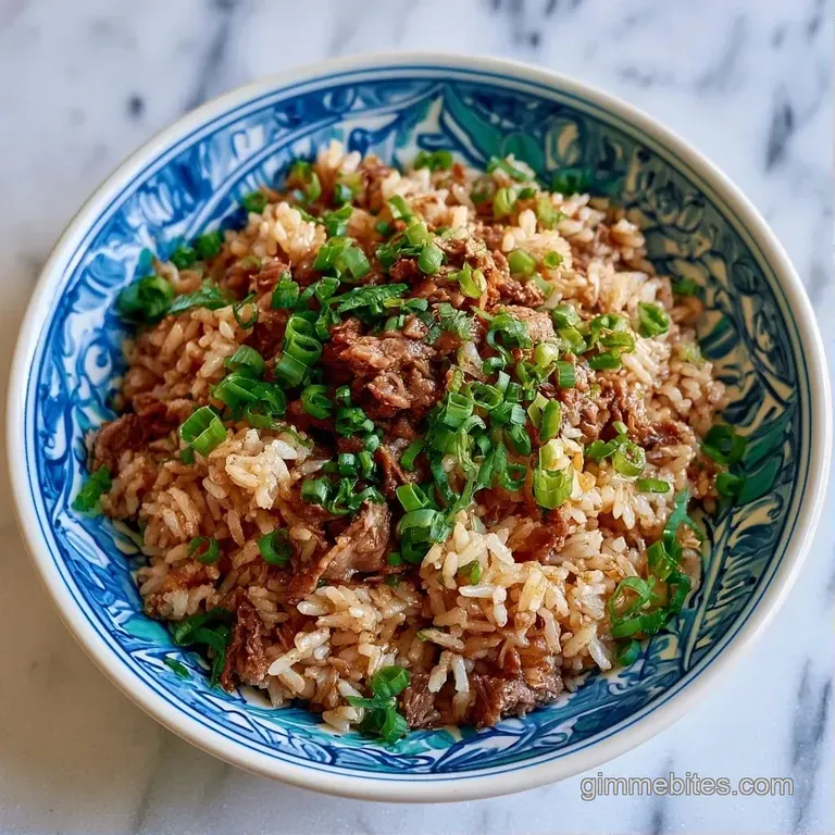 A wide skillet of browned beef and fluffy rice topped with fresh herbs, resting on a rustic wooden dining table.